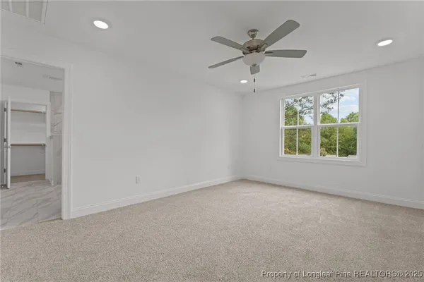 a bathroom with a granite countertop sink two mirror and shower