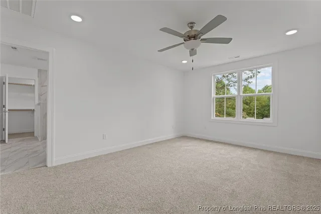 a bathroom with a granite countertop sink two mirror and shower