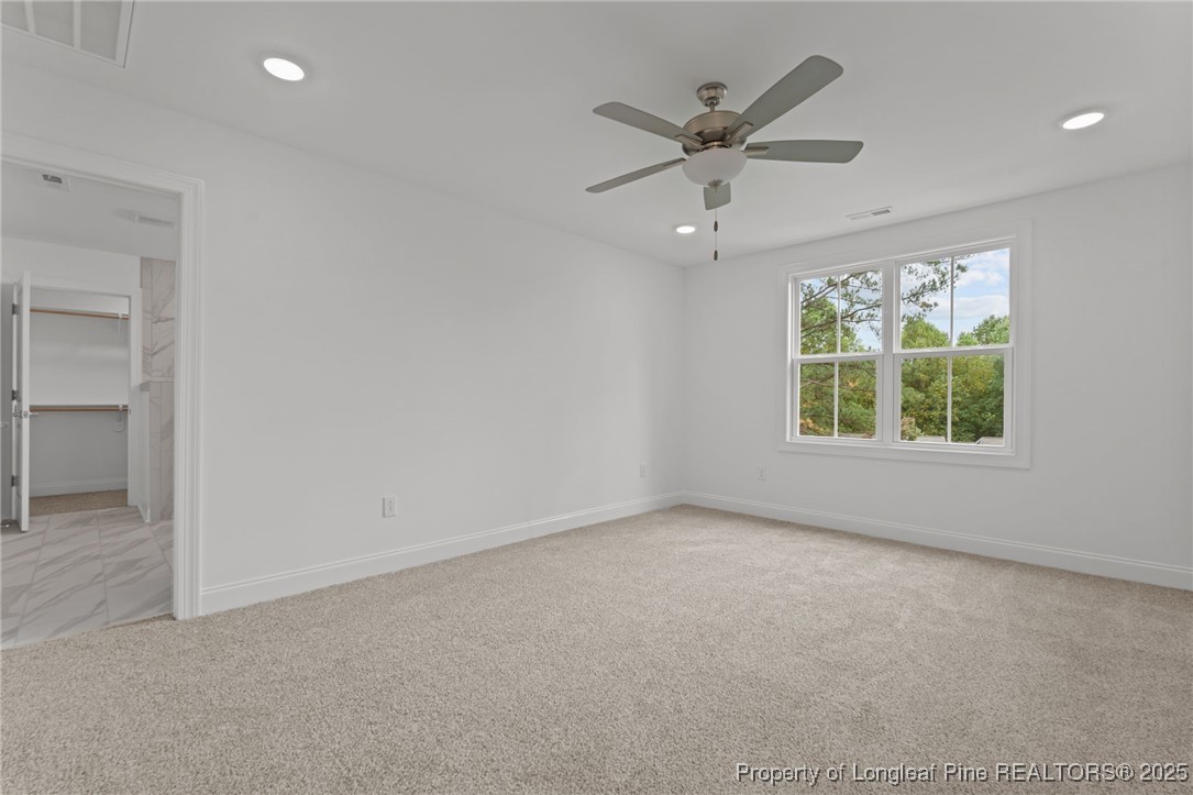 45 Pine Hill Court Spring Lake, NC 28390 - Photo 27 of 40 an empty room with windows and fan