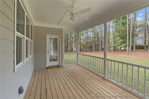 a view of a balcony with wooden floor