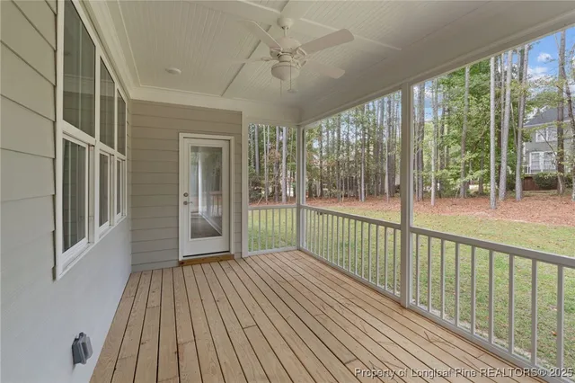 a view of a balcony with wooden floor