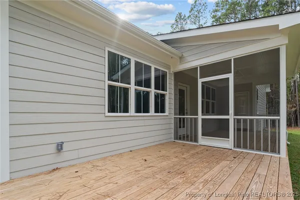 a view of outdoor space with deck and trees