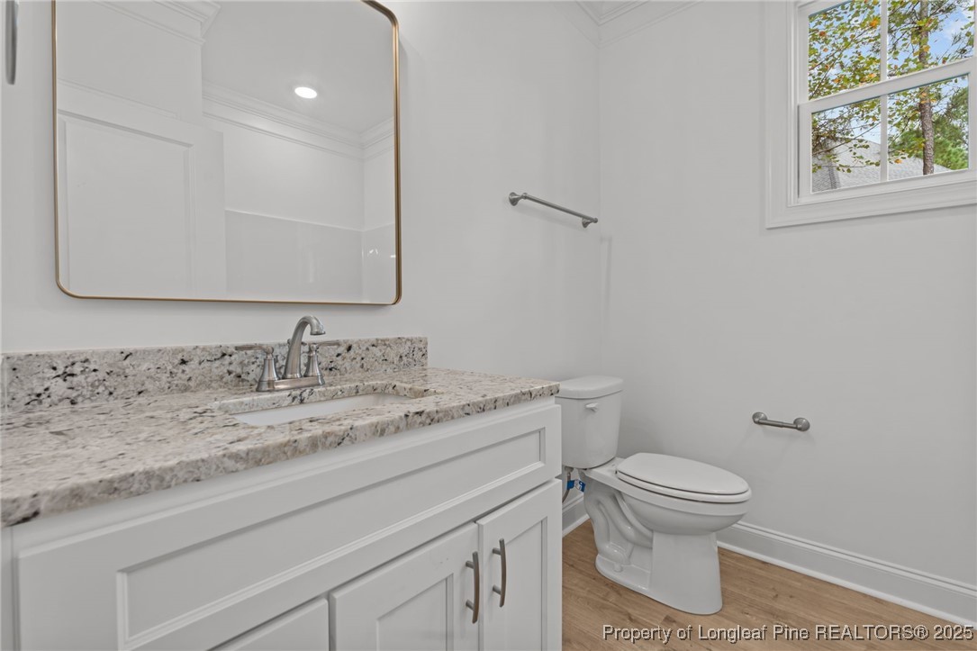 45 Pine Hill Court Spring Lake, NC 28390 - Photo 7 of 40 a bathroom with a granite countertop toilet sink and mirror