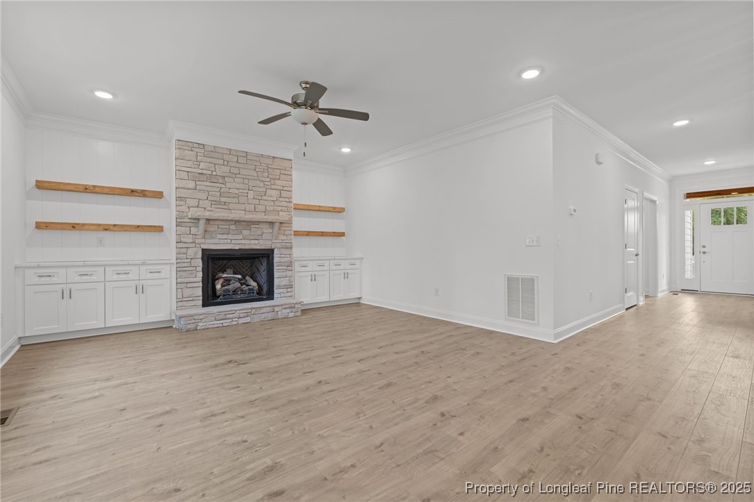 45 Pine Hill Court Spring Lake, NC 28390 - Photo 10 of 40 an empty room with windows and fireplace