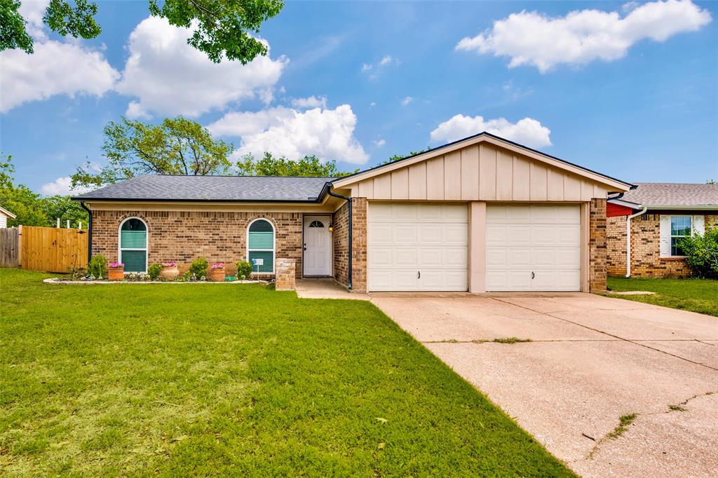 5901 Myers Road Arlington, TX 76017 - Photo 1 of 23 a front view of a house with garden