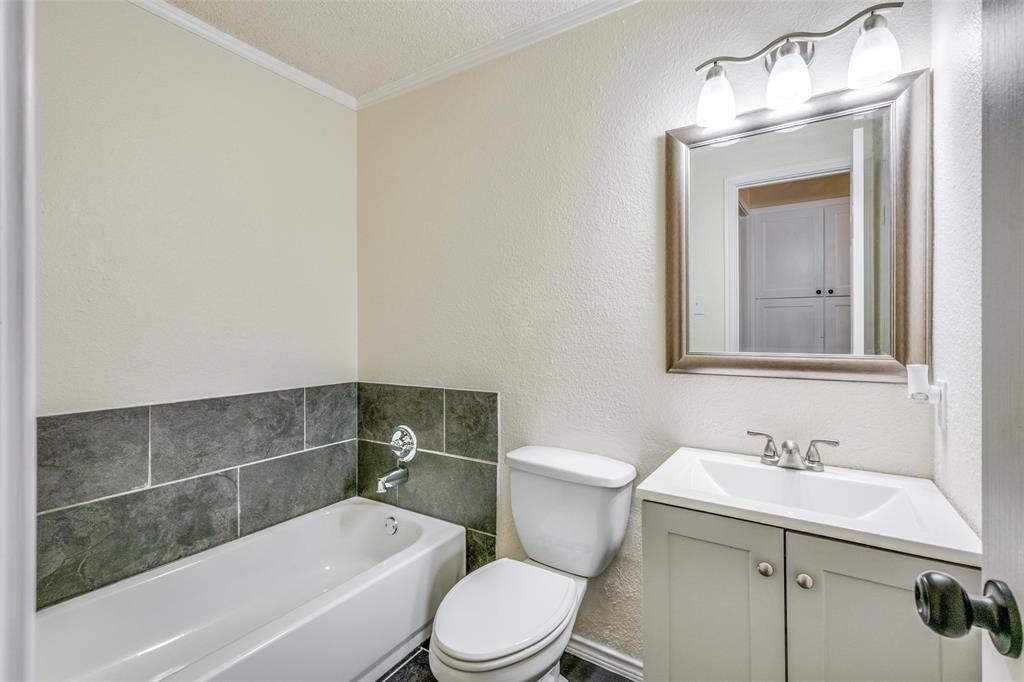 5901 Myers Road Arlington, TX 76017 - Photo 18 of 23 a bathroom with a sink a toilet and shower