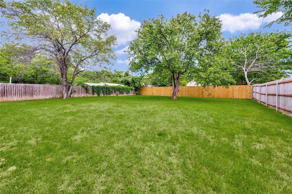 5901 Myers Road Arlington, TX 76017 - Photo 22 of 23 a view of a backyard with large trees