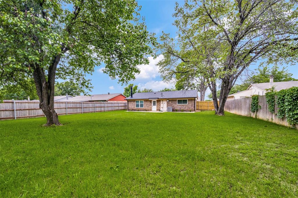 5901 Myers Road Arlington, TX 76017 - Photo 3 of 23 a view of yard with swimming pool and green space