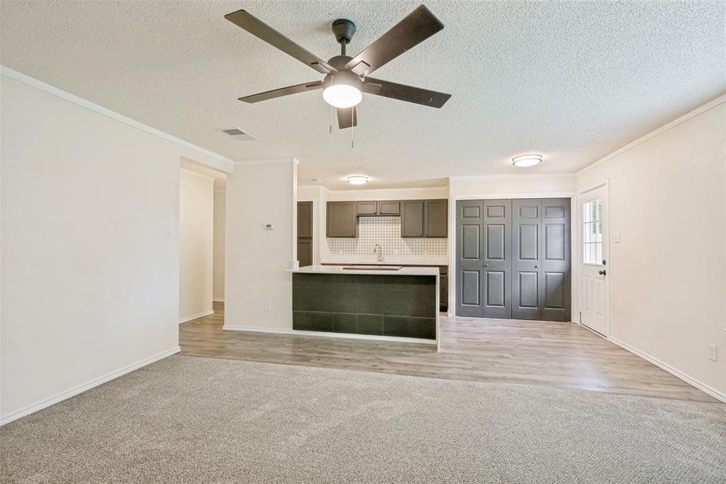 5901 Myers Road Arlington, TX 76017 - Photo 5 of 23 a view of an empty room with a kitchen