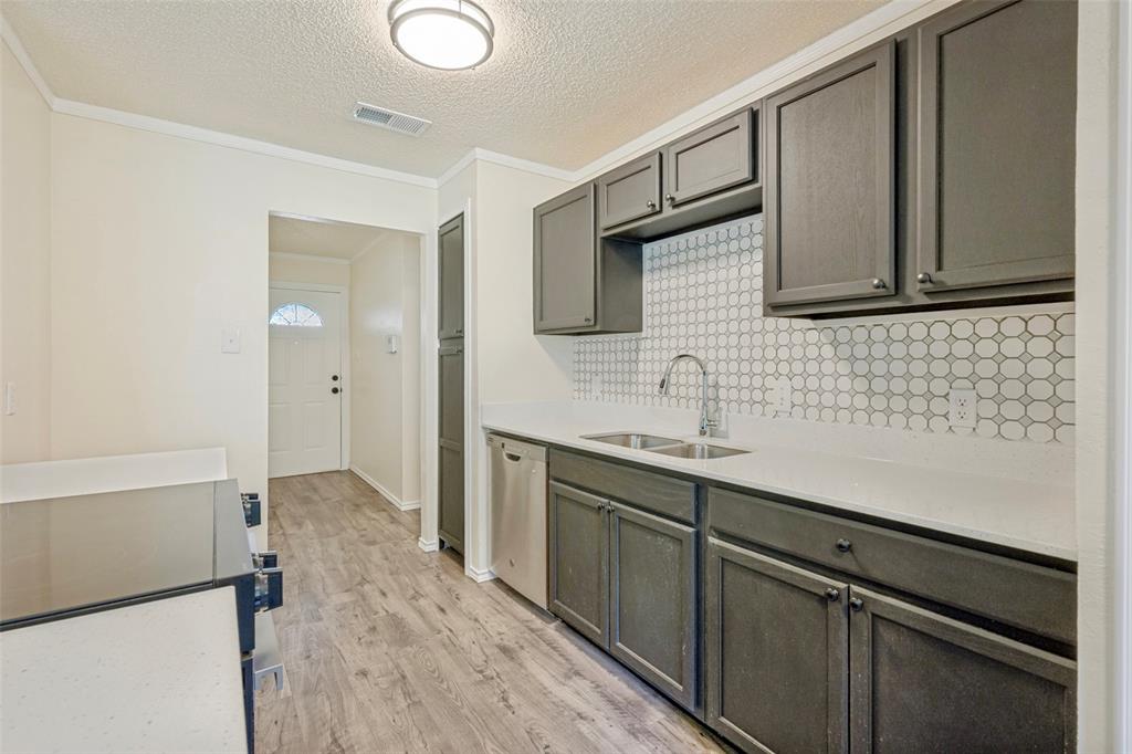 5901 Myers Road Arlington, TX 76017 - Photo 7 of 23 a bathroom with a sink a mirror and a shower