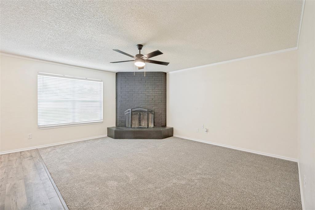 5901 Myers Road Arlington, TX 76017 - Photo 8 of 23 a view of a livingroom with a fireplace and a window