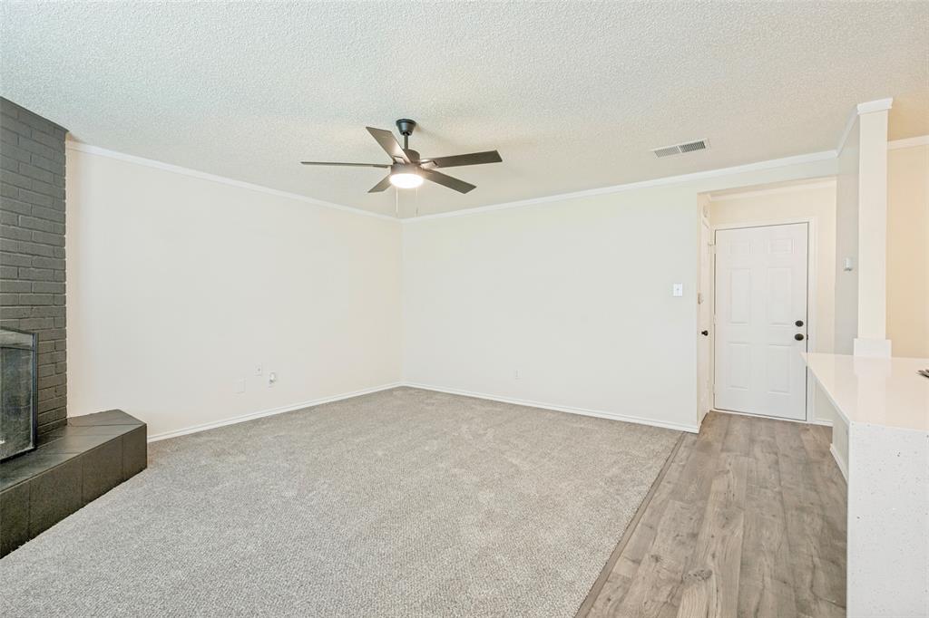 5901 Myers Road Arlington, TX 76017 - Photo 9 of 23 an empty room with a empty space and a ceiling fan
