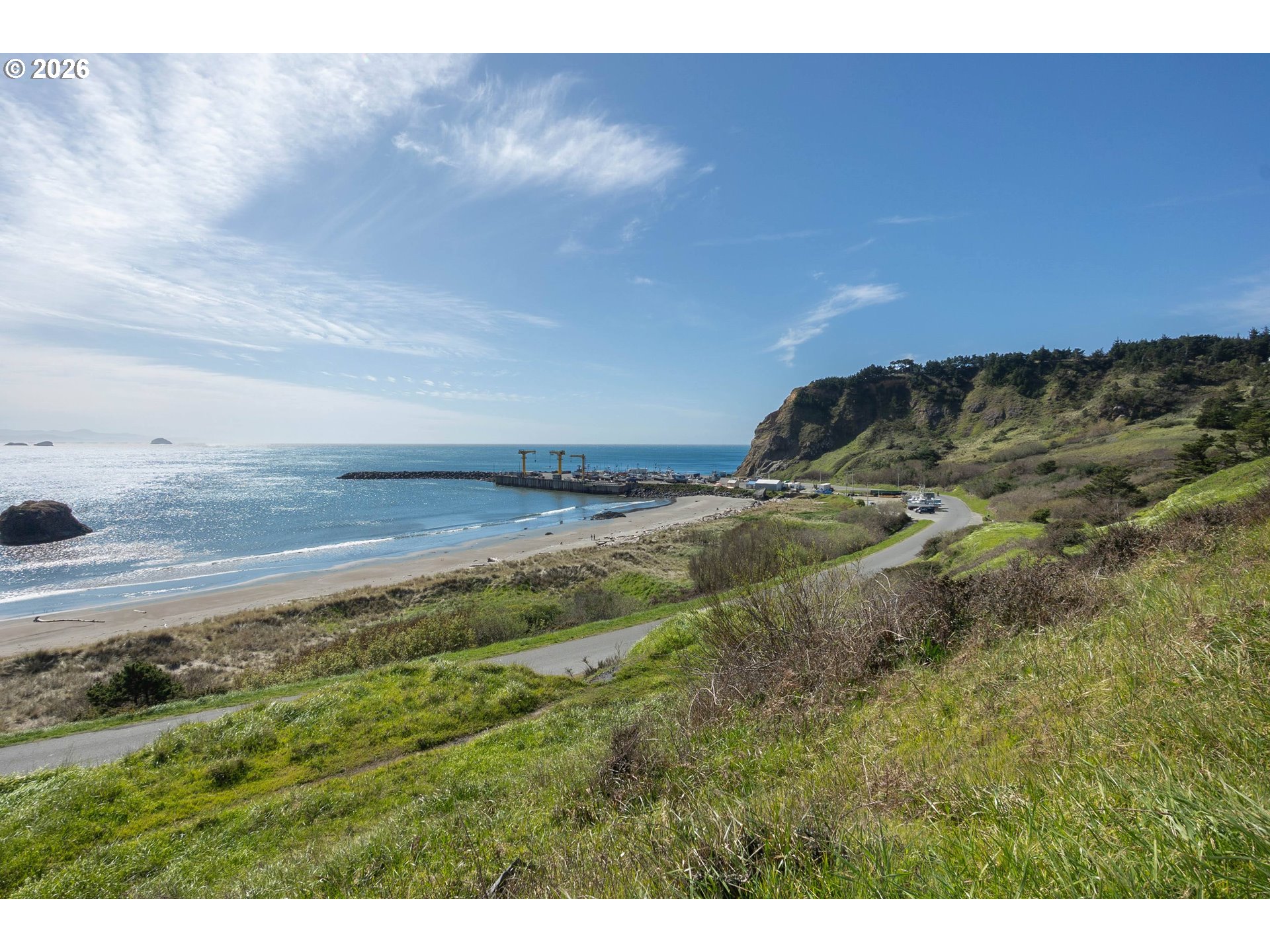 440 5th Street Port Orford, OR 97465 - Photo 2 of 8 a view of a field with an ocean