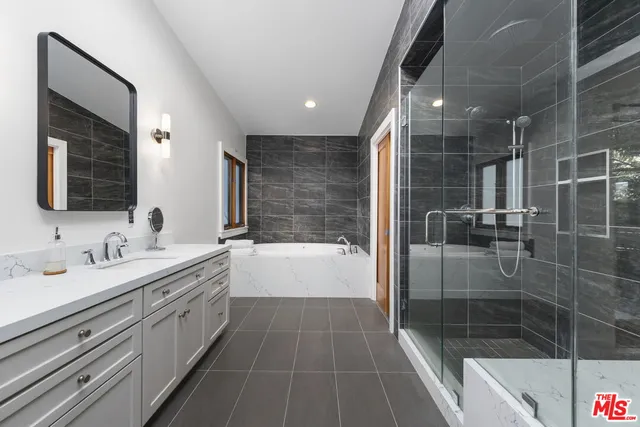 a bedroom with a bed and sliding door