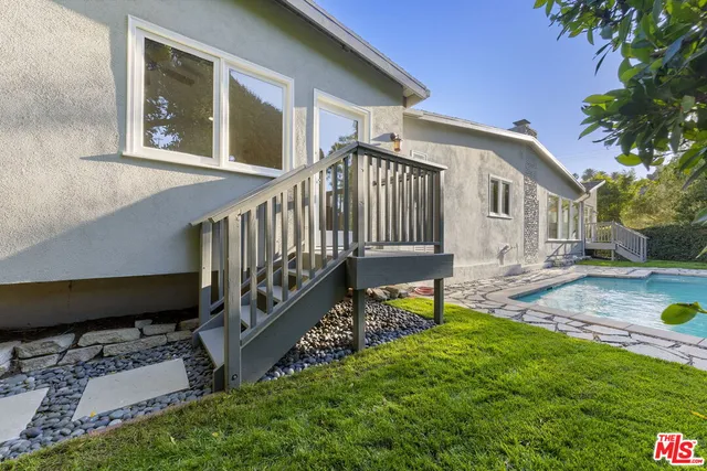 a view of a pathway both side of house