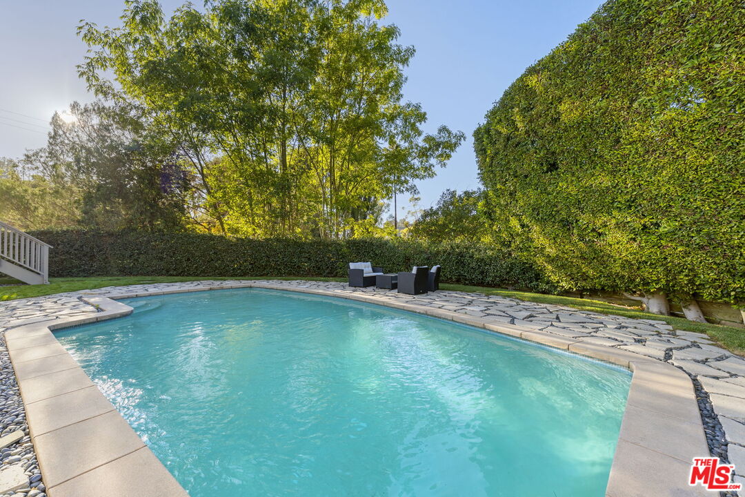 2601 Nichols Canyon Road Los Angeles, CA 90046 - Photo 20 of 28 a view of a swimming pool with a yard