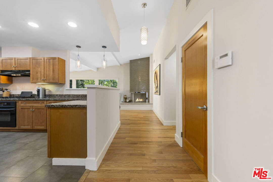 2601 Nichols Canyon Road Los Angeles, CA 90046 - Photo 7 of 28 a kitchen with stainless steel appliances granite countertop a refrigerator and a sink