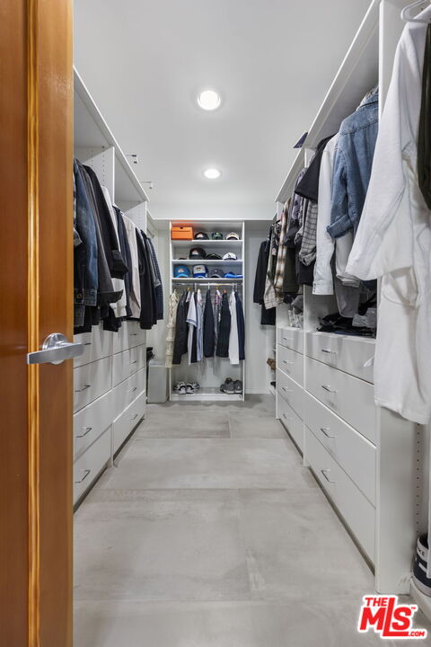 2601 Nichols Canyon Road Los Angeles, CA 90046 - Photo 10 of 28 a view of walk in closet with clothes and shoes