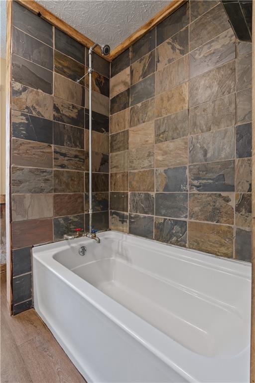 112 Brannon Road Buchanan, GA 30113 - Photo 27 of 40 a white bath tub sitting next to a shower