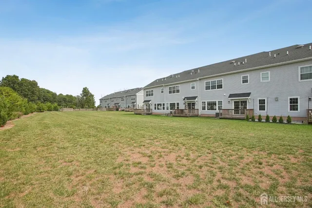 a large white house with a large pool