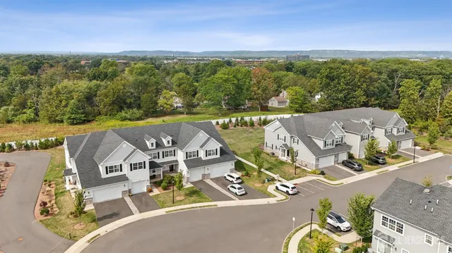 an aerial view of a house with a big yard