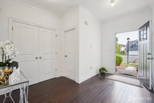 a view of an entryway with wooden floor