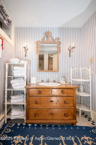 a view of a kitchen with a sink and cabinets