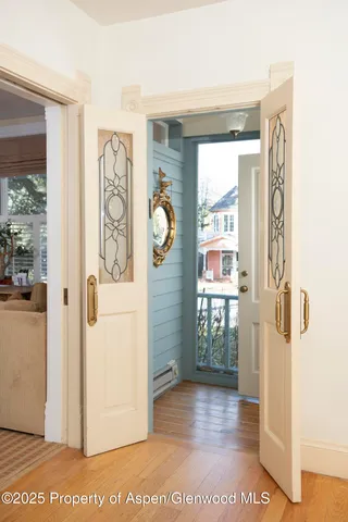 a living room with furniture rug and window