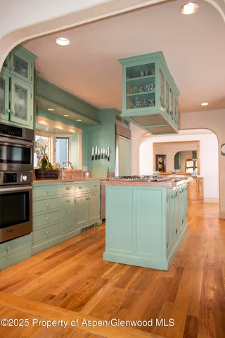 a kitchen with stainless steel appliances granite countertop a stove and a sink