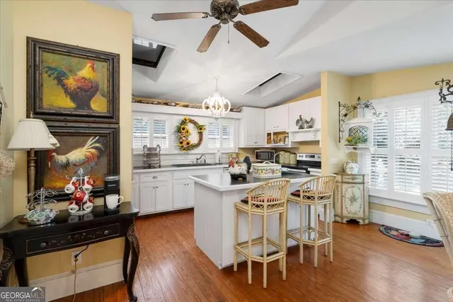 a view of a house with a yard patio and a garden