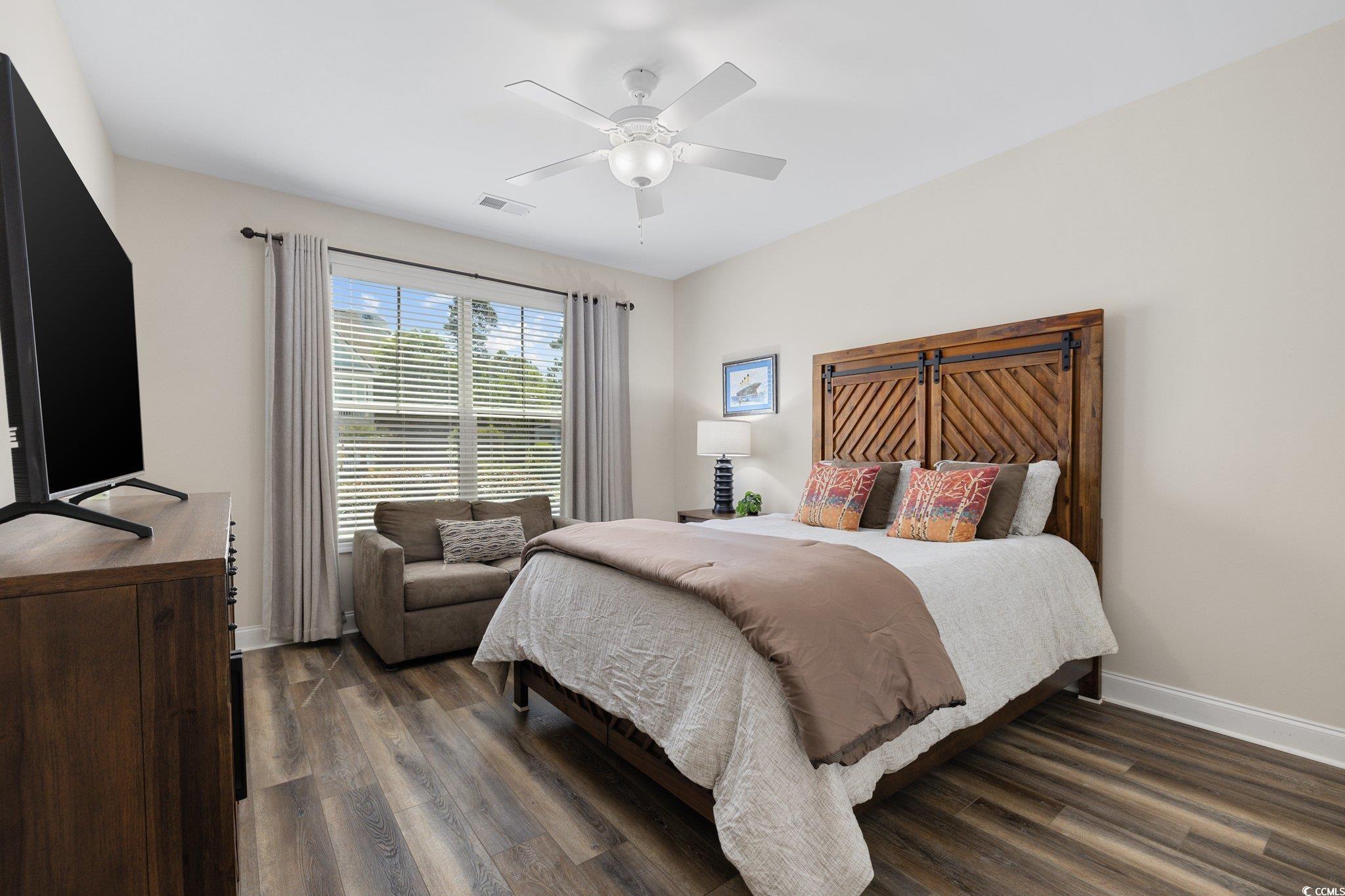 179 Hyacinth Loop Murrells Inlet, SC 29576 - Photo 18 of 40 Bedroom featuring ceiling fan, baseboards, visible vents, and dark wood finished floors