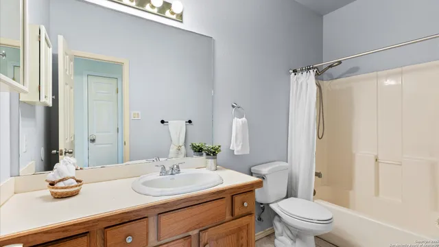 a bedroom with two beds and a window