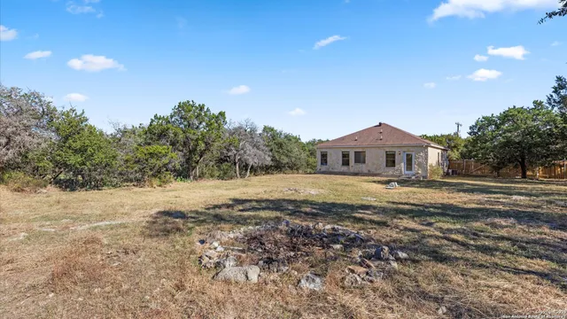a view of mountain view with large trees