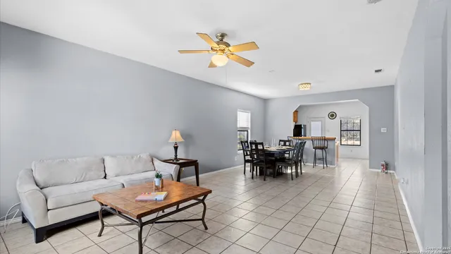 a bedroom with two beds and a chandelier