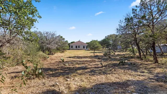 a kitchen with stainless steel appliances granite countertop a stove top oven a sink dishwasher and cabinets