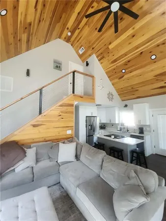 a view of a dining room with furniture wooden floor and a floor to ceiling window