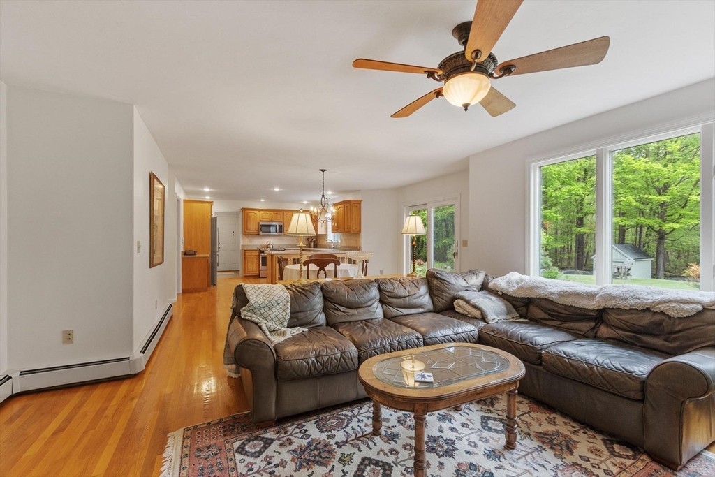 94 Turner Road Townsend, MA 01469 - Photo 14 of 42 a living room with furniture a rug and a large window