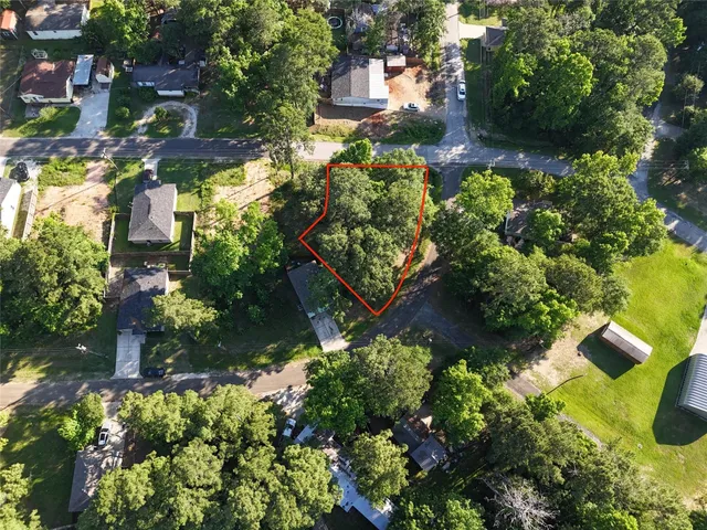 an aerial view of a house with a lake view