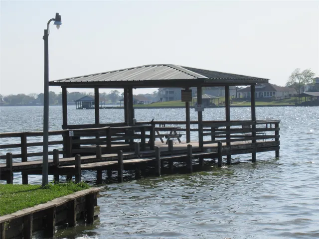 an aerial view of a house with swimming pool outdoor seating and yard