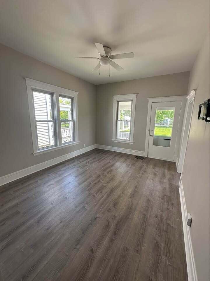 154 Napoleon Street Valparaiso, IN 46383 - Photo 2 of 7 an empty room with wooden floor and windows