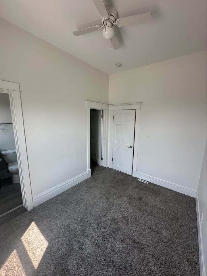154 Napoleon Street Valparaiso, IN 46383 - Photo 4 of 7 an empty room with a ceiling fan and carpet