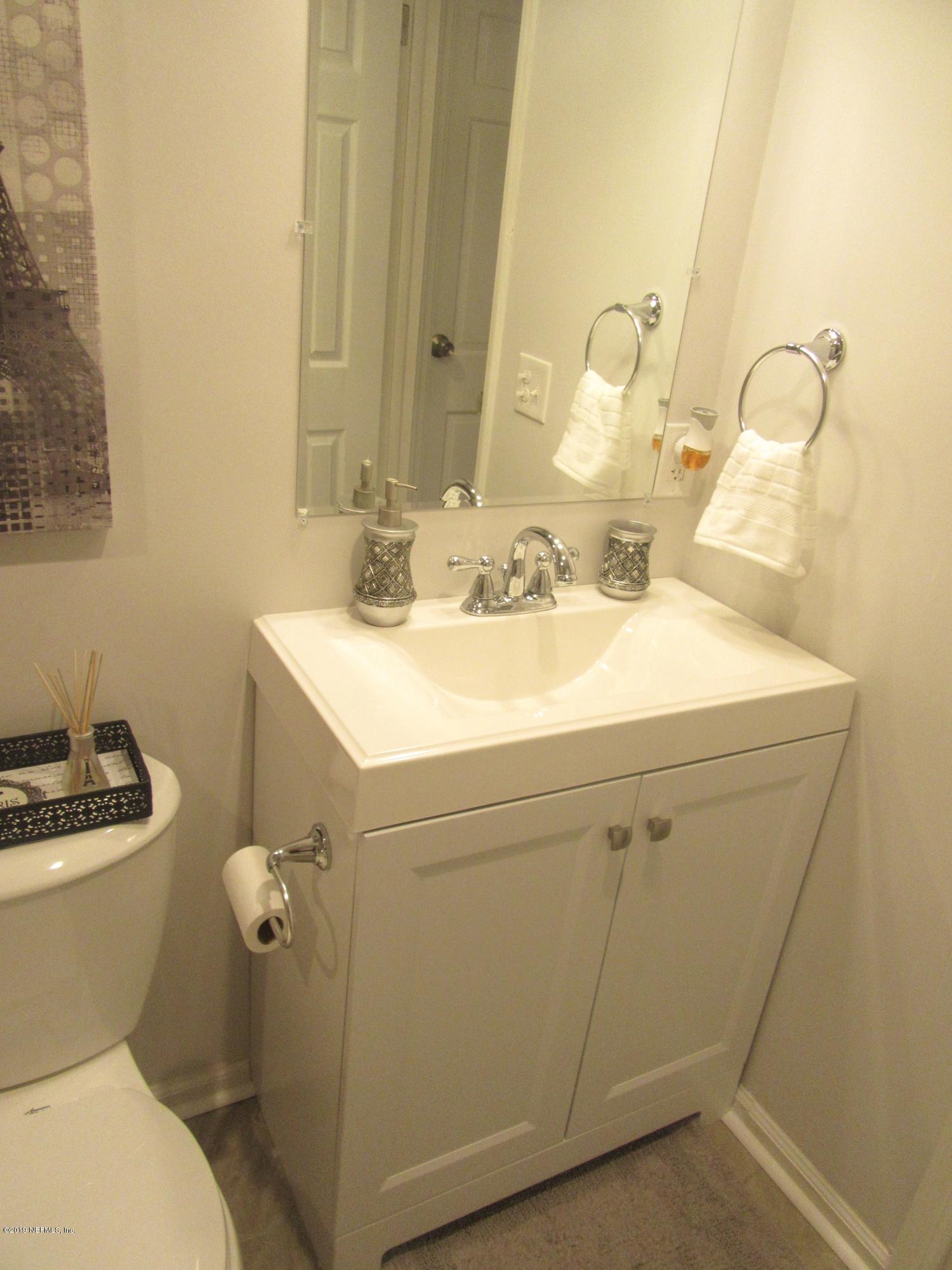 12584 Agatite Road Jacksonville, FL 32258 - Photo 17 of 41 a bathroom with a sink toilet and mirror