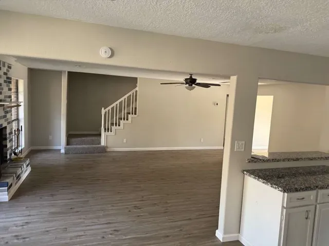 a view of a kitchen from an empty room