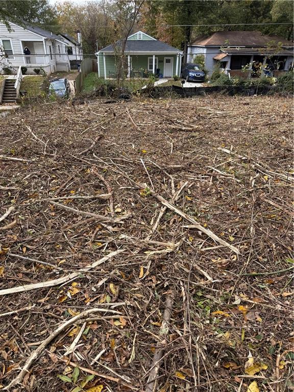 407 Paines Avenue Northwest Atlanta, GA 30314 - Photo 4 of 5 a backyard of a house with lots of green space