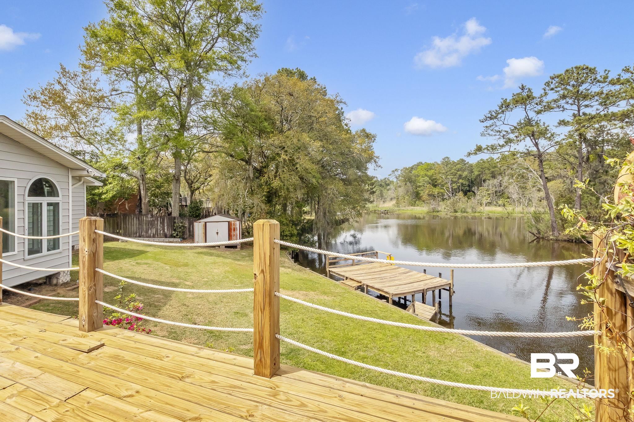 2901 Alston Court Mobile, AL 36605 - Photo 54 of 59 Deck featuring fence, a water view, and a yard