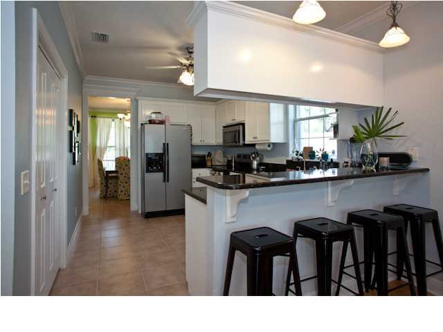 258 Seabreeze Circle Seacrest, FL 32461 - Photo 17 of 31 a kitchen with refrigerator and cabinets