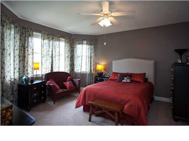 258 Seabreeze Circle Seacrest, FL 32461 - Photo 29 of 31 a bedroom with a bed window and couch