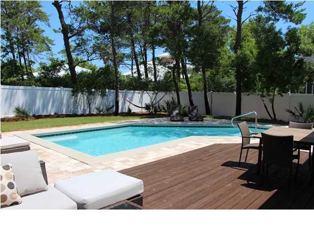 258 Seabreeze Circle Seacrest, FL 32461 - Photo 3 of 31 a swimming pool with outdoor seating and yard