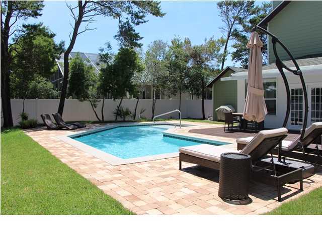 258 Seabreeze Circle Seacrest, FL 32461 - Photo 5 of 31 a swimming pool with outdoor seating and yard