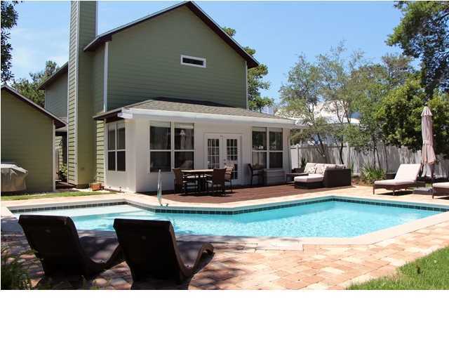258 Seabreeze Circle Seacrest, FL 32461 - Photo 7 of 31 a swimming pool with outdoor seating and yard